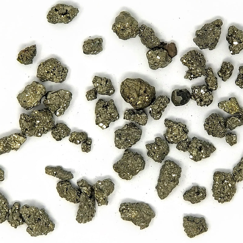 Pyrite scattered on a white background