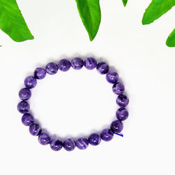 Round bead Amethyst bracelet on white background