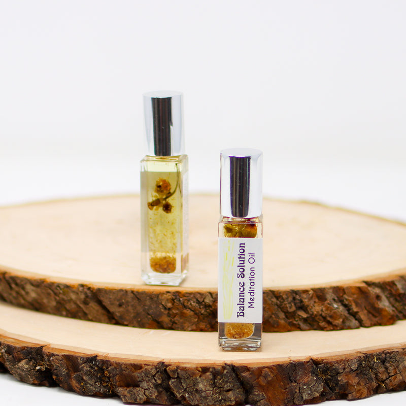 A front and back view of Balance Solution Meditation Oil with a white background