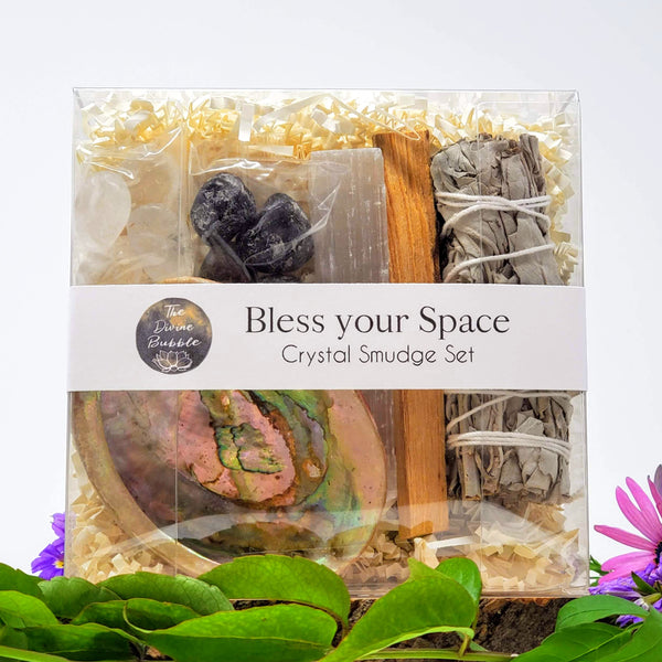 Bless your Space Crystal Smudge Ritual - This crystal and smudge set was designed to wrap you in a blanket of clearing and protection, helping to ward off any and all negative energy in your space and turn it into a Sanctuary. Boxed Set with white sage, palo santo, 4 Apache tears, 4 Clear Quartz, selenite stick, and abalone shell