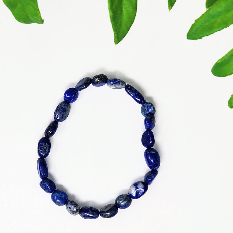 Tumble bead Lapis Lazuli bracelet on white background