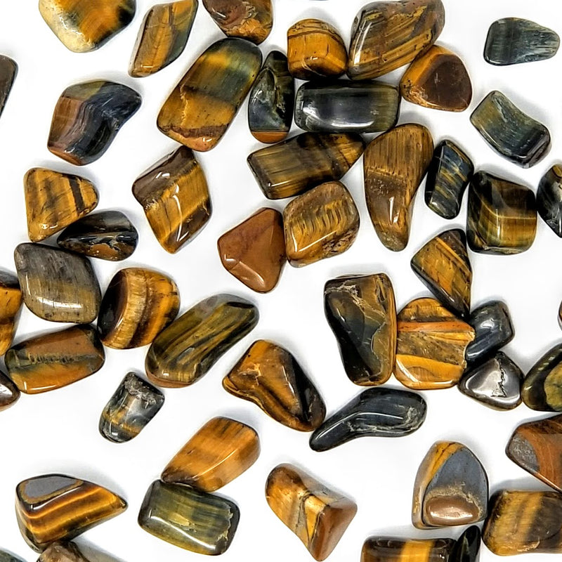Tiger's Eye Tumbled Stones scattered on a white background